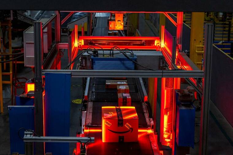 REUTERS/EDUARDO MUNOZ
                                Boxes are scanned during Cyber Monday at Amazon’s fulfillment center in Robbinsville, N.J., on Monday.