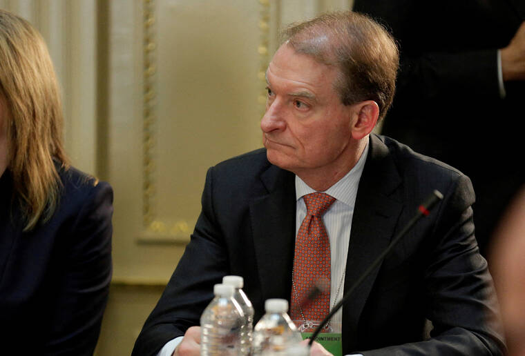 REUTERS/JOSHUA ROBERTS / 2017
                                CEO of Patomak Global Partners LLC Paul Atkins takes part in a strategic and policy CEO discussion with President Donald Trump in the Eisenhower Execution Office Building in Washington.