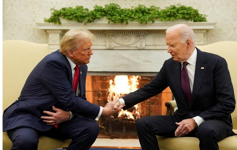 REUTERS/KEVIN LAMARQUE
                                President Joe Biden meets with President-elect Donald Trump in the Oval Office at the White House in Washington, today.