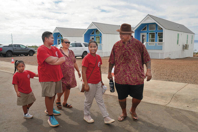 FEDERAL EMERGENCY MANAGEMENT AGENCY
                                Lafaele Folaumoeloa with his wife, Ane, and their three children.