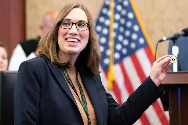 NATHAN HOWARD / REUTERS
                                U.S. Rep-elect Sarah McBride (D-Del.) picks during a lottery drawing for office assignments for new House members-elect of the incoming 119th Congress on Capitol Hill in Washington on Nov. 21.