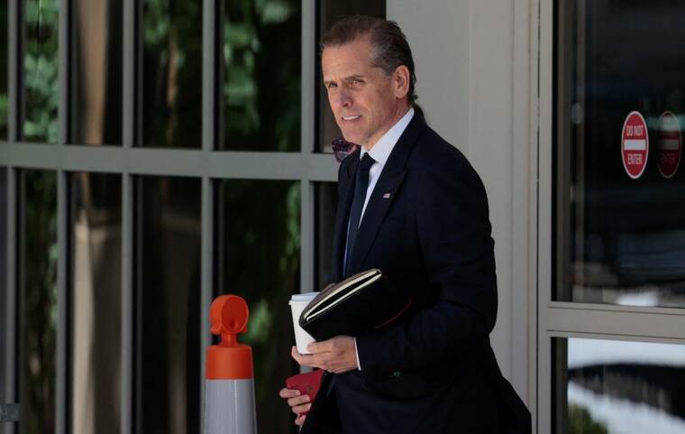 REUTERS/HANNAH BEIER/FILE PHOTO
                                Hunter Biden, son of President Joe Biden, departs the federal court during his trial on criminal gun charges in Wilmington, Del., on June 7. The White House today defended President Joe Biden’s decision to pardon his son, Hunter, and said the president believed his political opponents would have kept persecuting his son going forward.