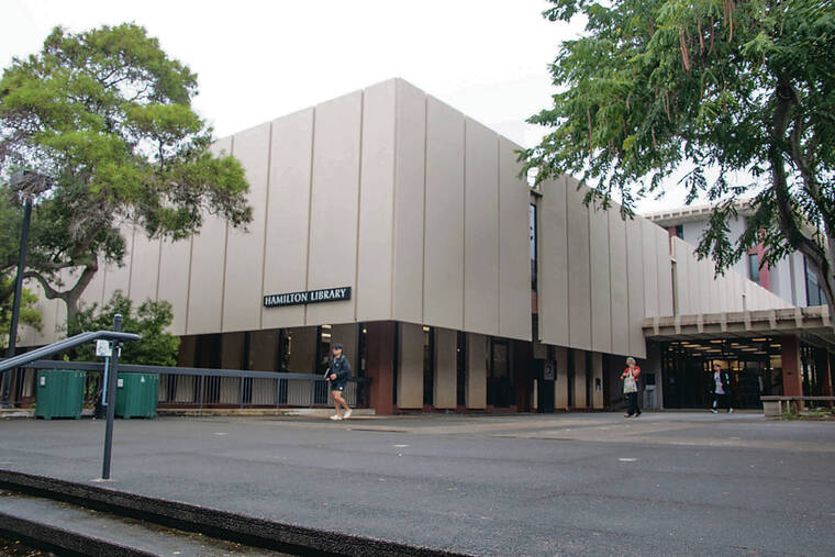 CRAIG T. KOJIMA / CKOJIMA@STARADVERTISER.COM
                                Wednesday marks the 20th anniversary of a flash flood of mud and water that tore across UH and damaged 30 buildings, most notably Hamilton Library’s basement and first floor. The entrance to Hamilton Library shown Monday, top.