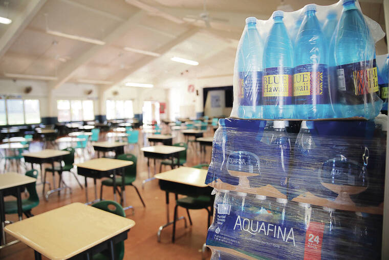 JAMM AQUINO / 2022
                                Bottled water was stocked in the cafeteria at Red Hill Elementary School, one of the schools affected by the Navy’s water contamination crisis, as the school slowly transitioned back to tap water usage. The University of Hawaii has formed the Red Hill Registry to connect those who were affected by the incident.