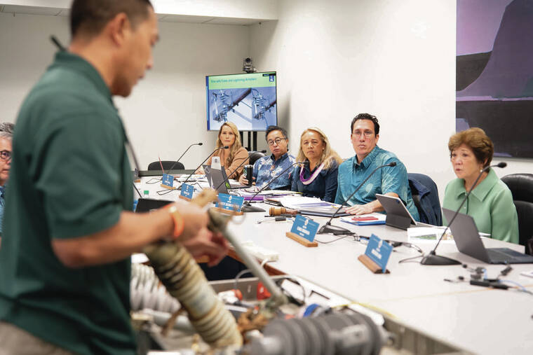 COURTESY ZOE WILKS Kurt Tsukiyama, Hawaiian Electric director of transmission and distribution operations on the neighbor islands, displayed a power line fuse for a panel of state senators Friday during a briefing on the company’s wildfire risk reduction plan.