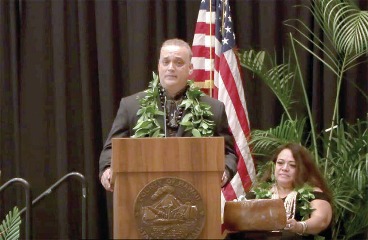 COURTESY PHOTOS
                                Mayor Kimo Alameda looked at the audience Monday during his inaugural address at Kaleiopapa Convention Center on the grounds of the Outrigger Kona Resort and Spa in Keauhou. Seated to his right is emcee Lorna Lim.