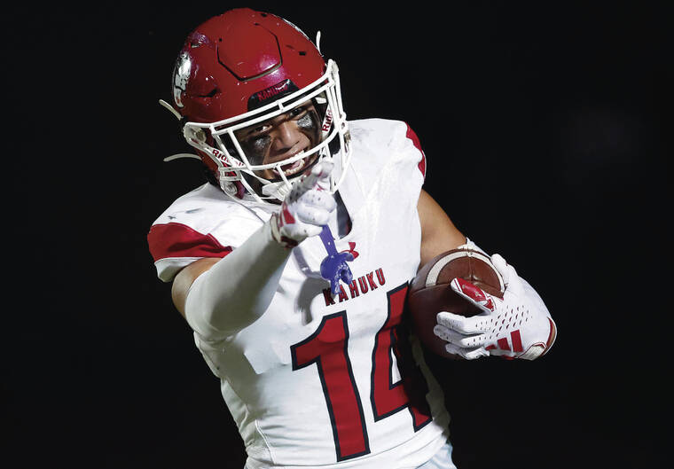 JAMM AQUINO / NOV. 8
                                Kahuku wide receiver Aiden Manutai celebrated a go-ahead touchdown against Campbell during the OIA Open Division championship at Farrington.