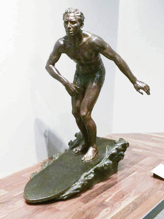 COURTESY PETER VON BUOL
                                A sculpture of Sargent Kahana­moku surfing is on display at the Field Museum in Chicago.