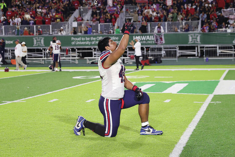 ANDREW LEE/ SPECIAL TO THE STAR-ADVERTISER
                                Saint Louis’ Pupualii Sepulona celebrates after winning the HHSAA Open Division Football Championship Game 17-10 over Kahuku on Friday at Clarence T.C. Ching Field in Honolulu.